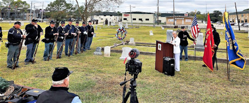 Sister Susan Barry, President of the Houston DUVCW Tent at the podium offering the biography of the Union veteran during the ceremony.